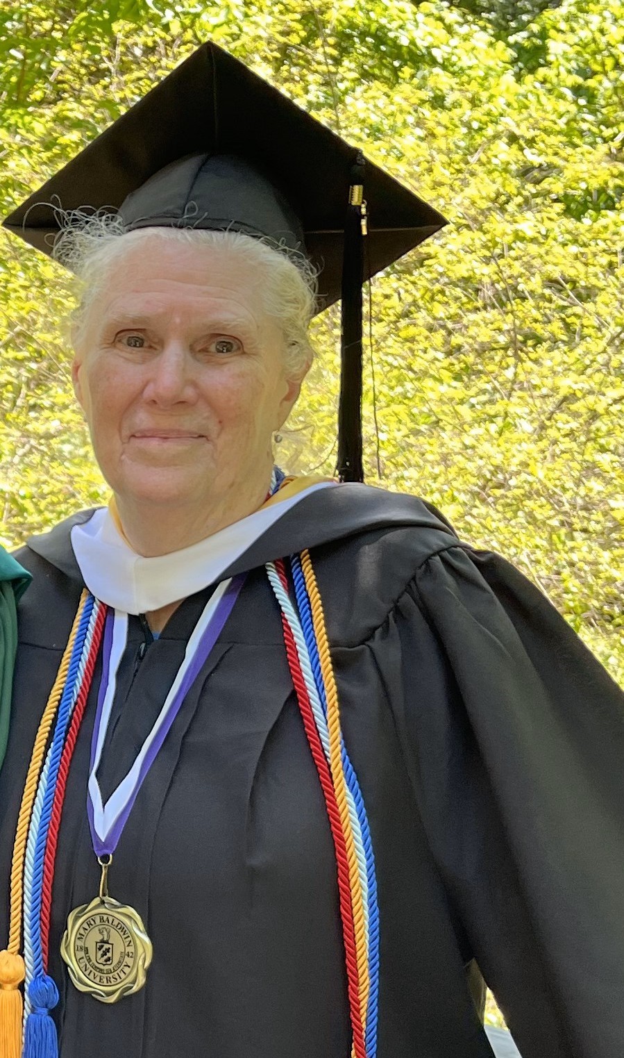 older woman wearing graduation gown